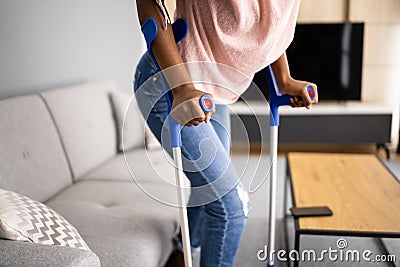 Walking With Crutches. Injured Broken Leg Stock Photo