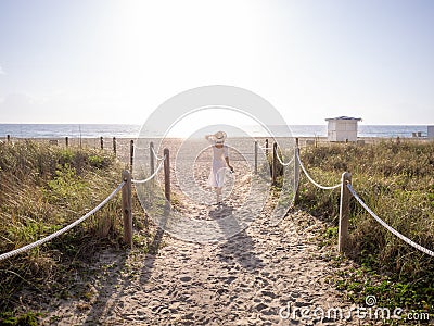 Walking girl on the beach Stock Photo