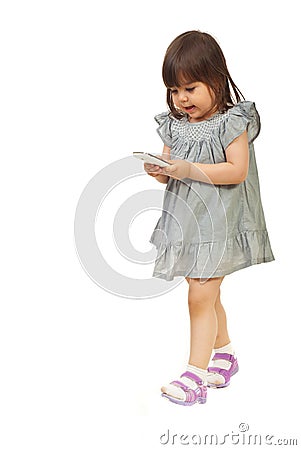 Walking girl searching on phone mobile Stock Photo