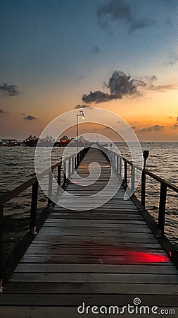 Walking at jetty wooden bridge on early morning Stock Photo