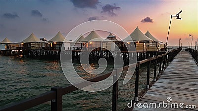 Walking at jetty wooden bridge on early morning Stock Photo