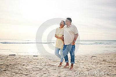 Walking, love and senior couple at beach happy, relax and bond in nature together. Ocean, embrace and old people at the Stock Photo