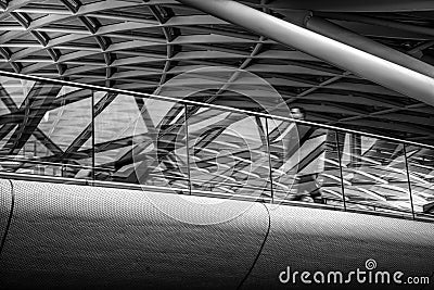 Walking man on footbridge Stock Photo