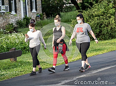 Walking In Public Park Wearing Face Mask Editorial Stock Photo