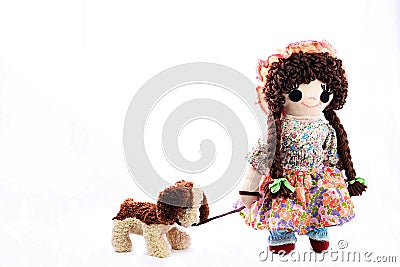 Heel Puppy, let`s go for a walk. New pose. Vintage girl rag doll with her puppy; presented on a plain white background. Stock Photo