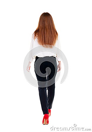 Walking redhead business woman. Stock Photo