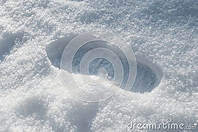 Walking in the snow. Fresh snowy shoeprints. Close up Stock Photo