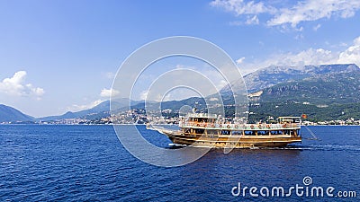 Walking tourist ship off the coast of Montenegro Stock Photo