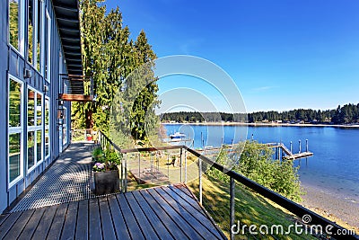 Walkout deck of luxurious home with an amazing view of lake. Stock Photo