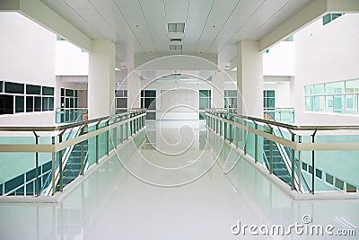 Walkway office building background business lobby reception hall interior. Background interior view looking out toward to empty wa Stock Photo