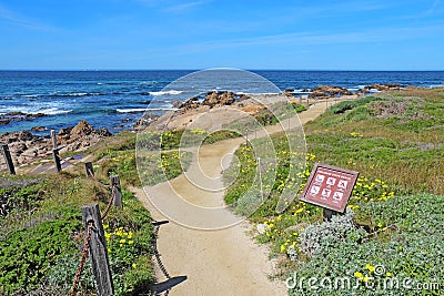 Walkway and sign for Asilomar State beach in Pacific Grove, Cali Editorial Stock Photo