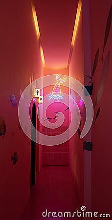 The walkway to the bathroom is decorated with LED lights in red and pink-yellow tones in the ocean concept. Editorial Stock Photo