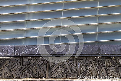 Wall with attached decorative pieces of cut wood on a patterned metallic background Stock Photo