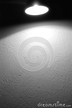 Wall background texture and spot light lamp and beam of light black and white background Stock Photo