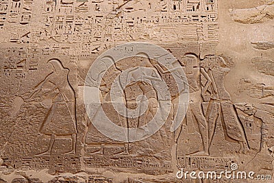 Wall carvings at the temple of Ramses III in Medinet habu, Luxor, Egypt Editorial Stock Photo