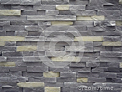 Wall cladding made of cement artificial stone slabs. Colors are gray and pale yellow Stock Photo