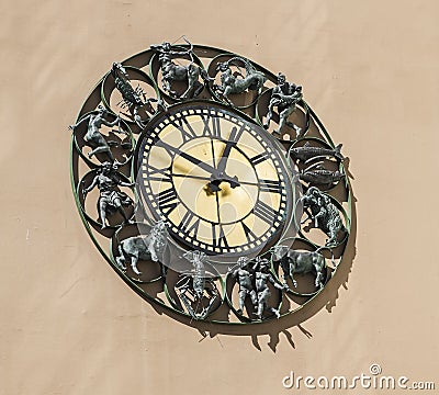 Wall clock with figurines zodiac signs Stock Photo