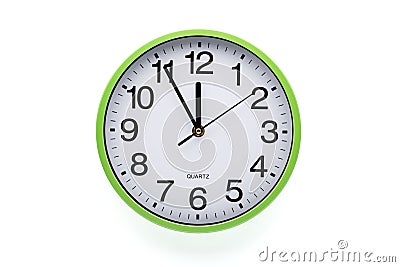 Wall clock on white background. Clipping path included. Five minutes to twelve Stock Photo