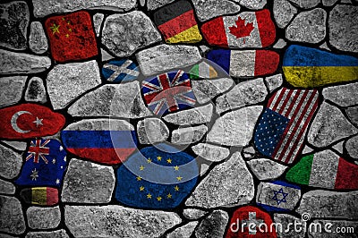Wall consisting of stones painted in different flags of the world Stock Photo