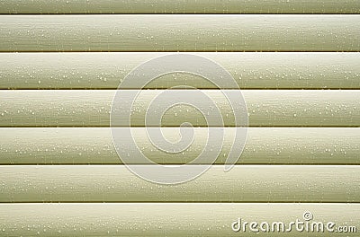 Wall covered with beige siding with many water drops after rain closeup as background Stock Photo