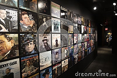 A wall covered with Johnny Cash album covers at the Johnny Cash Museum in Nashville Tennessee Editorial Stock Photo