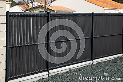 wall dark grey aluminum barrier and gray fence of private individual house modern new protect home Stock Photo