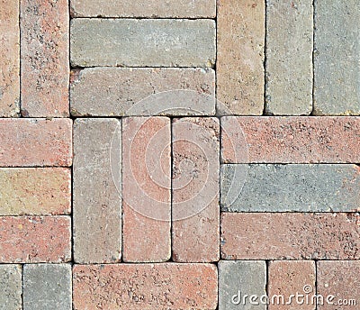 Wall from different colored bricks put together Stock Photo