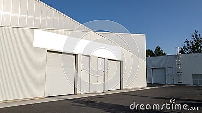 Wall facade industrial building company with blank signage empty banner ready for text brand artwork mockup Stock Photo