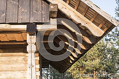 Wall frame finish with burned timber planks on log house attic and the rafters on log house roof construction Stock Photo