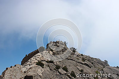 The wall of Genoese Fortress as a part of rock, Crimea Stock Photo