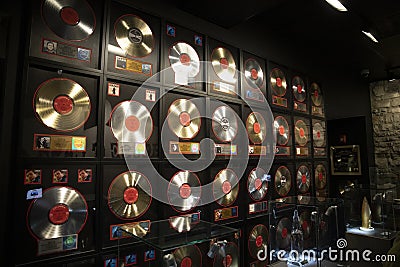 A wall of gold and platinum records from Johnny Cash on display inside of the Johnny Cash Museum in Nashville Tennessee Editorial Stock Photo