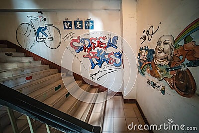 Wall graffiti inside residential block of flats in China Editorial Stock Photo