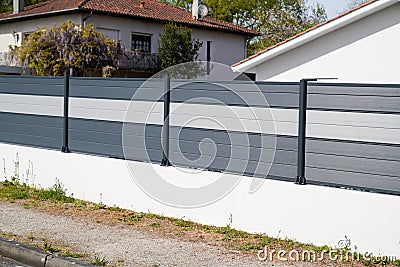 Wall grey aluminum modern barrier of suburb house protect view home garden Stock Photo