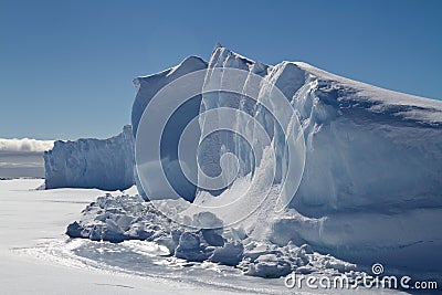 Wall of icebergs frozen in the ice of Antarctica Stock Photo