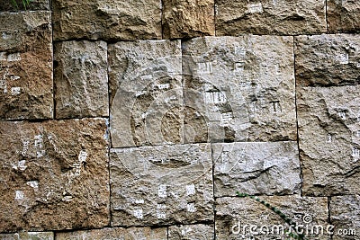 The wall of the large stone blocks, with a pattern. Background. Texture Stock Photo