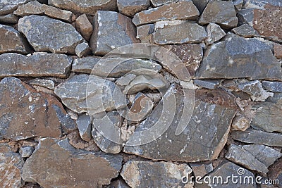 Wall from large stone textured basalt. Good background for wallpaper. Stock Photo