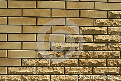 Wall of light smooth and uneven bricks Stock Photo