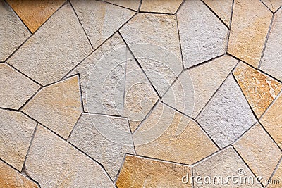 Wall lined with decorative stone. Pattern of polygonal stone blocks Stock Photo