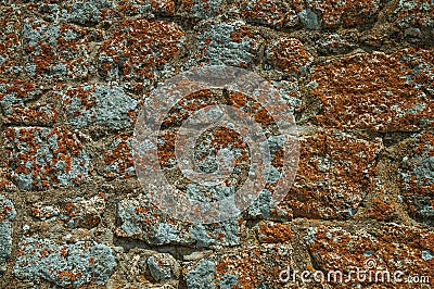 Wall made of stones forming a singular background in Monsanto Stock Photo