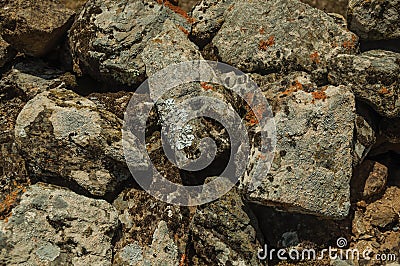 Wall made of stones with moss and lichens at Evoramonte Stock Photo