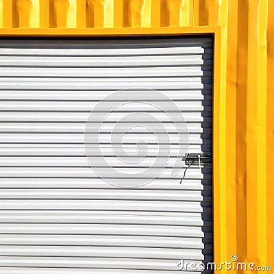 Wall of metallic sheet in yellow and white Stock Photo