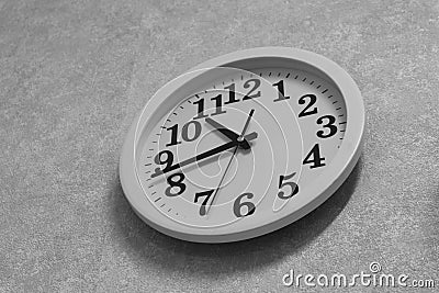 Wall-mounted mechanical quartz clock in black and white Stock Photo