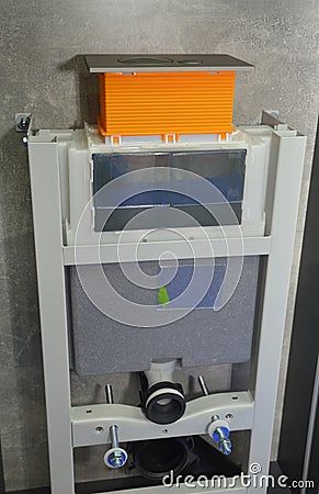 A wall-mounted toilet installation. A concealed toilet frame with a dual flush cistern of a built-in, wall hung toilet Stock Photo