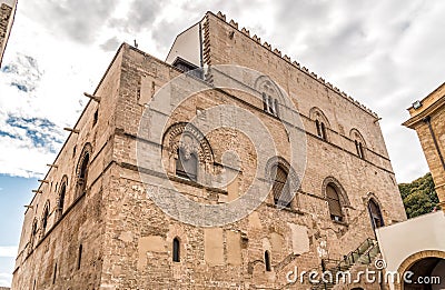 Wall with Mullioned windows with lava stone inlays of the Palace Steri Chiaramonte, Palermo, Sicily, Italy Stock Photo