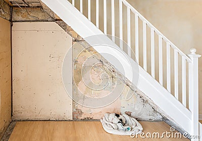 Old bare wall and staircase before being plastered. Stock Photo