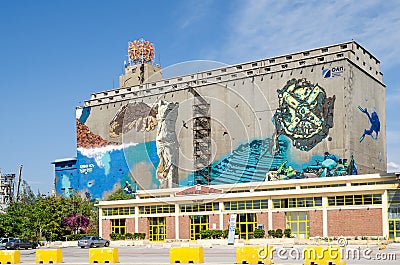 Wall painting on one of the old silo and dry docks buildings Editorial Stock Photo