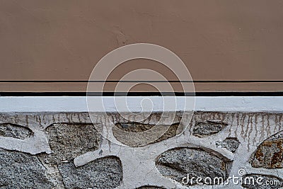 Wall with plaster and stones Stock Photo