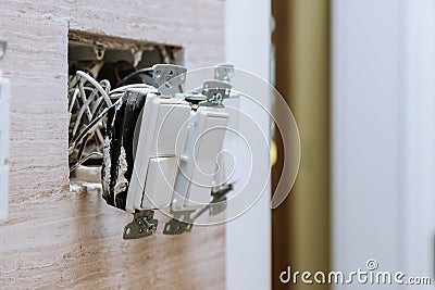 Wall power installation with installing group of electrical switch on bathroom interior Stock Photo