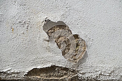 Wall showing patch of damaged render Stock Photo