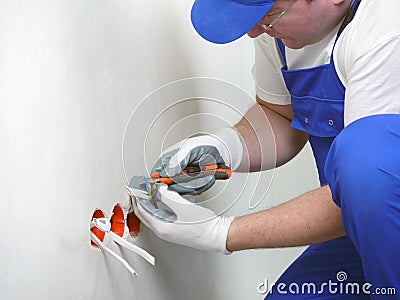 Wall socket installation Stock Photo